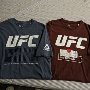 Two UFC size large shirts